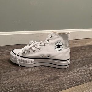 Brand new, platform high-top white Converse size 7.5. Perfect condition!